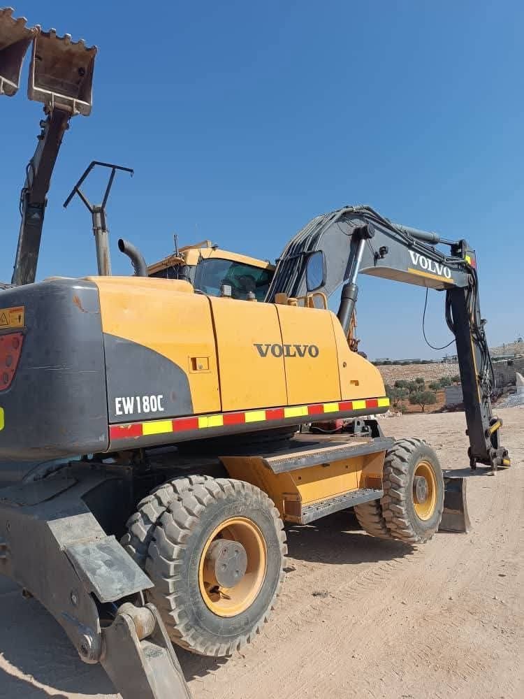 Buy and sell excavators in Egypt, available Volvo EW180C backhoe excavator, model 2011, in excellent condition, available in Suez