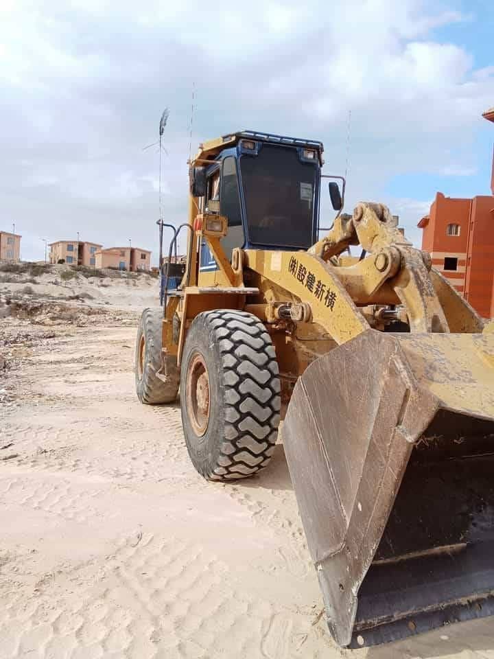 Komatsu loader for sale in Assiut, Komatsu 350, model 2000, located in Assiut. The best site for selling trucks and heavy equipment in Egypt.